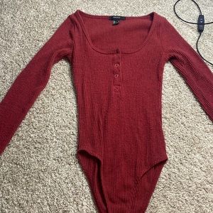 Red bodysuit top great to pair with the perfect Jean pants